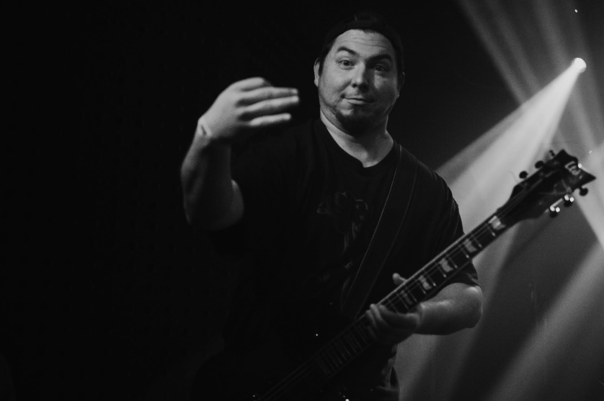 Koceto playing guitar during a Broken performance